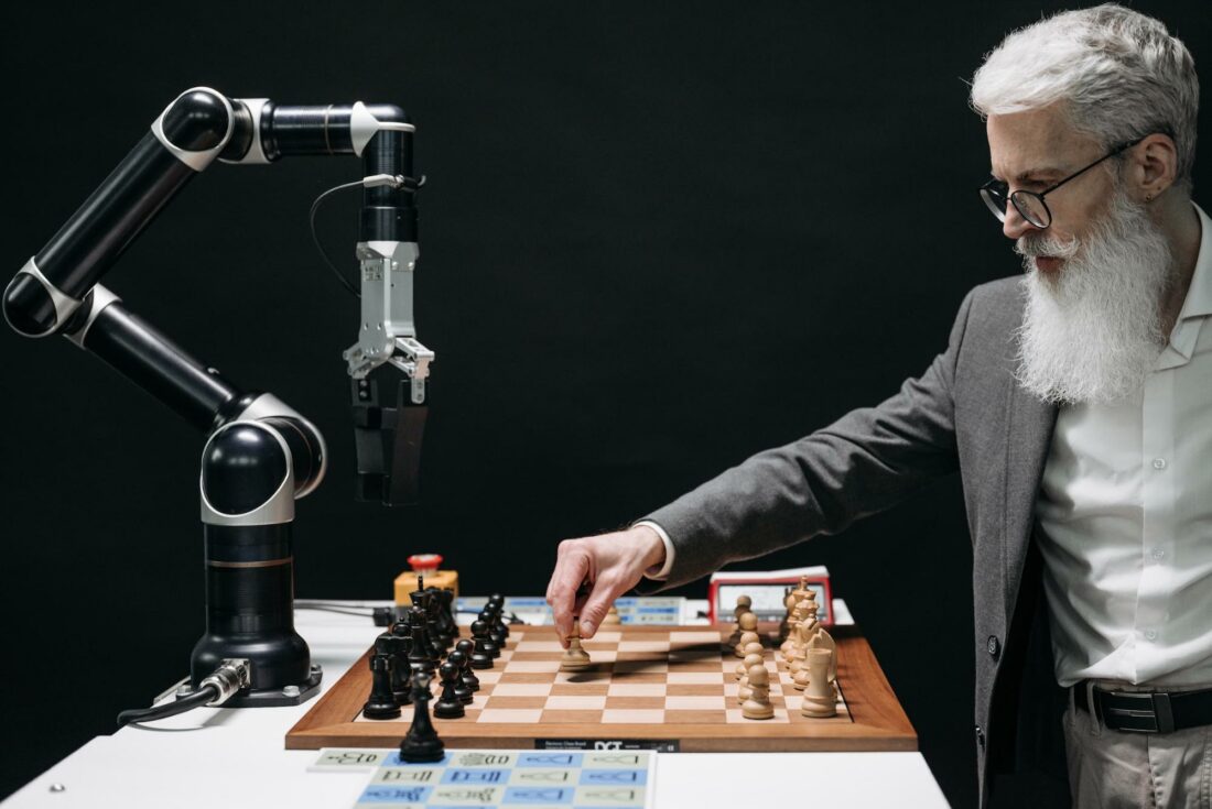 man playing chess with a robot AI.